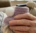 Plush Booties with Pompoms Pattern step 3 - details and accessories