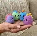 Colourful Mini Dino Amigurumi Pattern step 4 - final assembly and finishing